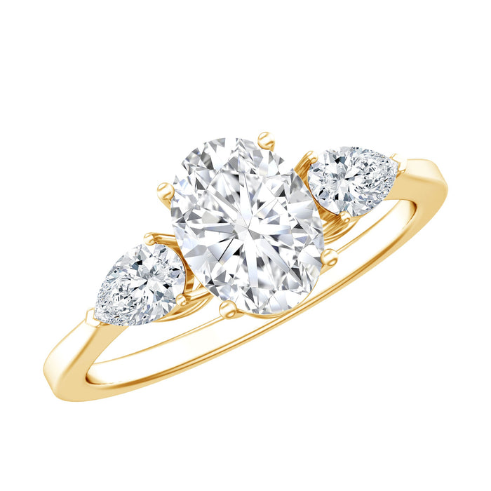 Oval and pear cut moissanite three stone engagement ring from Rosec Jewels, featuring sparkling gemstones and intricate band design.