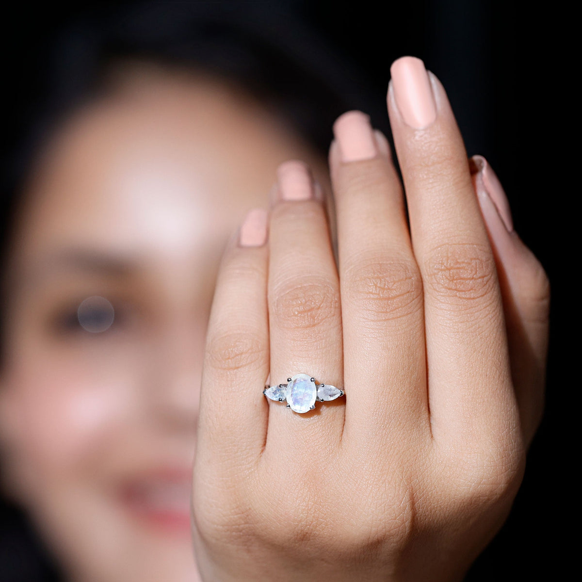 Natural moonstone three-stone engagement ring by Rosec Jewels, featuring a central moonstone flanked by two smaller stones on a silver band.