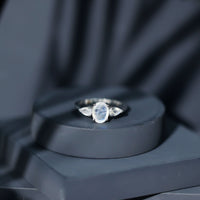 Natural moonstone three-stone engagement ring by Rosec Jewels featuring elegant, polished gemstones and a delicate band design.