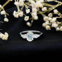 Natural moonstone three-stone engagement ring by Rosec Jewels featuring a delicate band and sparkling moonstone gemstones.