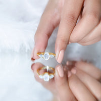 Natural moonstone three-stone engagement ring by Rosec Jewels featuring polished moonstones and a silver band.