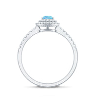 Elegant aquamarine and diamond teardrop engagement ring with double halo setting by Rosec Jewels.