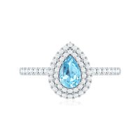 Elegant aquamarine and diamond teardrop engagement ring with double halo by Rosec Jewels, featuring intricate design details.