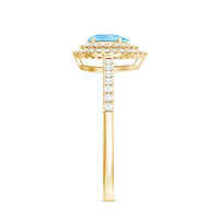 Rosec Jewels classic aquamarine and diamond teardrop engagement ring with double halo, showcasing intricate metalwork and sparkling gemstones.