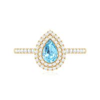 Elegant aquamarine and diamond teardrop engagement ring with double halo by Rosec Jewels, showcasing intricate design and sparkling gemstones.