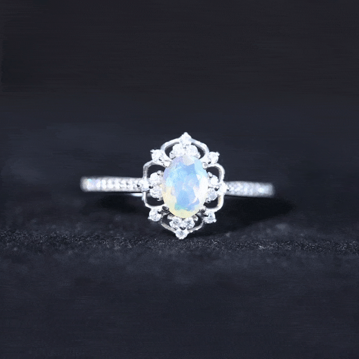 Oval Ethiopian Rainbow Opal vintage engagement ring with diamond, featuring intricate design and rose gold band from Rosec Jewels.