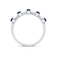 Elegant blue sapphire half eternity ring with diamonds by Rosec Jewels, showcasing a row of sparkling sapphires and diamonds in a classic design.