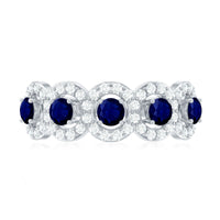 Rosec Jewels blue sapphire half eternity anniversary ring with diamonds, showcasing a band of alternating sapphires and diamonds.