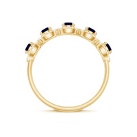 Classic blue sapphire and diamond half eternity ring by Rosec Jewels, showcasing a band with alternating sapphires and diamonds.