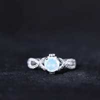 Ethiopian Opal and Diamond Engagement Ring with Crossover Shank