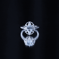 Vintage aquamarine and diamond engagement ring by Rosec Jewels featuring a detailed band and a central aquamarine gemstone.
