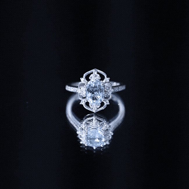 Vintage aquamarine and diamond engagement ring from Rosec Jewels featuring a yellow gemstone and sparkling accents.