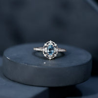 Vintage aquamarine and diamond engagement ring from Rosec Jewels featuring a detailed band and a stunning central gemstone.