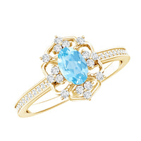 Vintage aquamarine and diamond engagement ring by Rosec Jewels featuring a detailed design and sparkling gemstones.