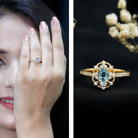 Vintage aquamarine and diamond engagement ring by Rosec Jewels featuring a central aquamarine gemstone with diamond accents.