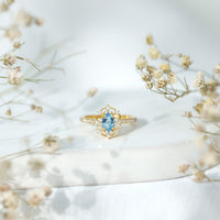 Vintage aquamarine and diamond engagement ring by Rosec Jewels with certificate, featuring a detailed band and vibrant gemstone.
