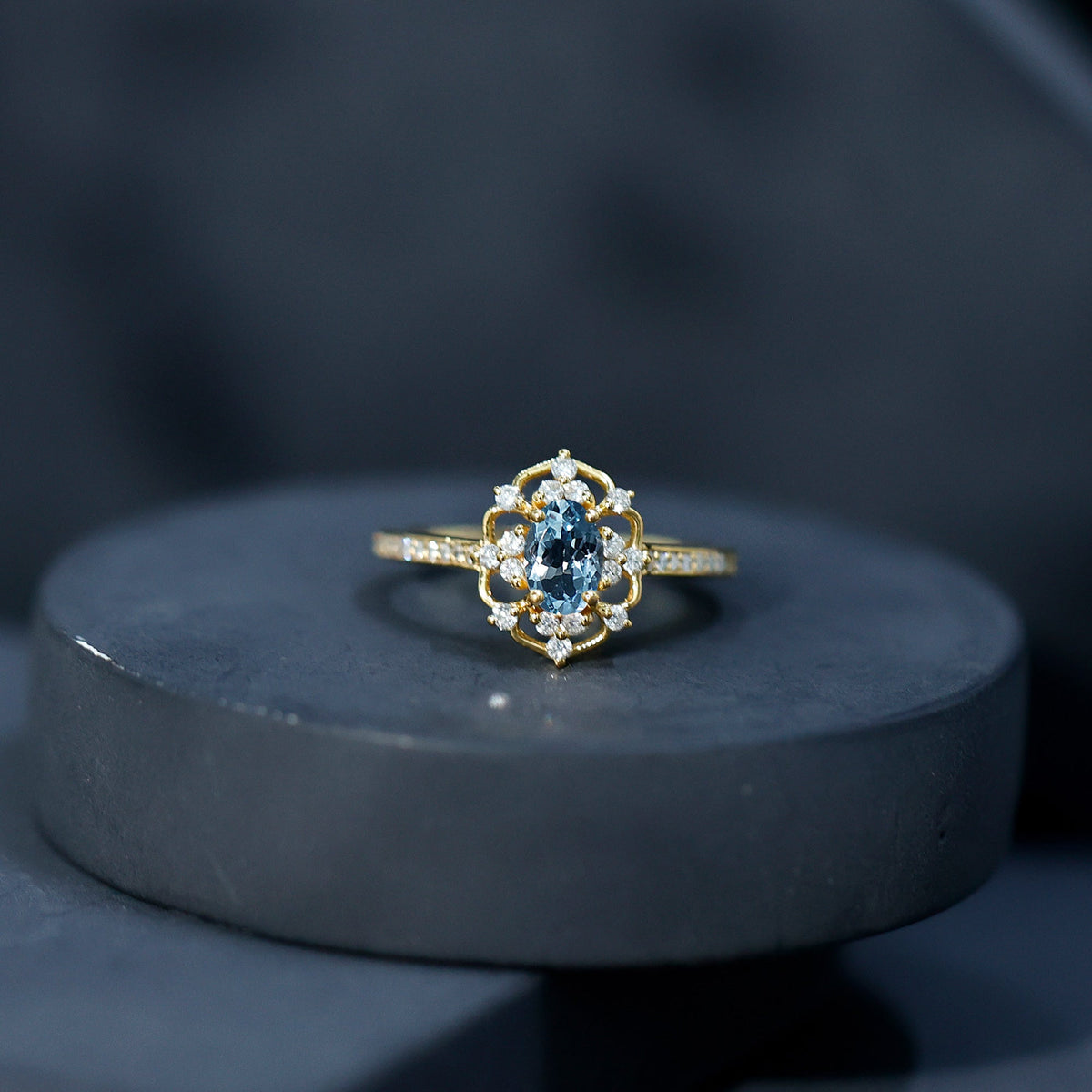 Vintage aquamarine and diamond engagement ring by Rosec Jewels featuring a detailed band and a central aquamarine gemstone.