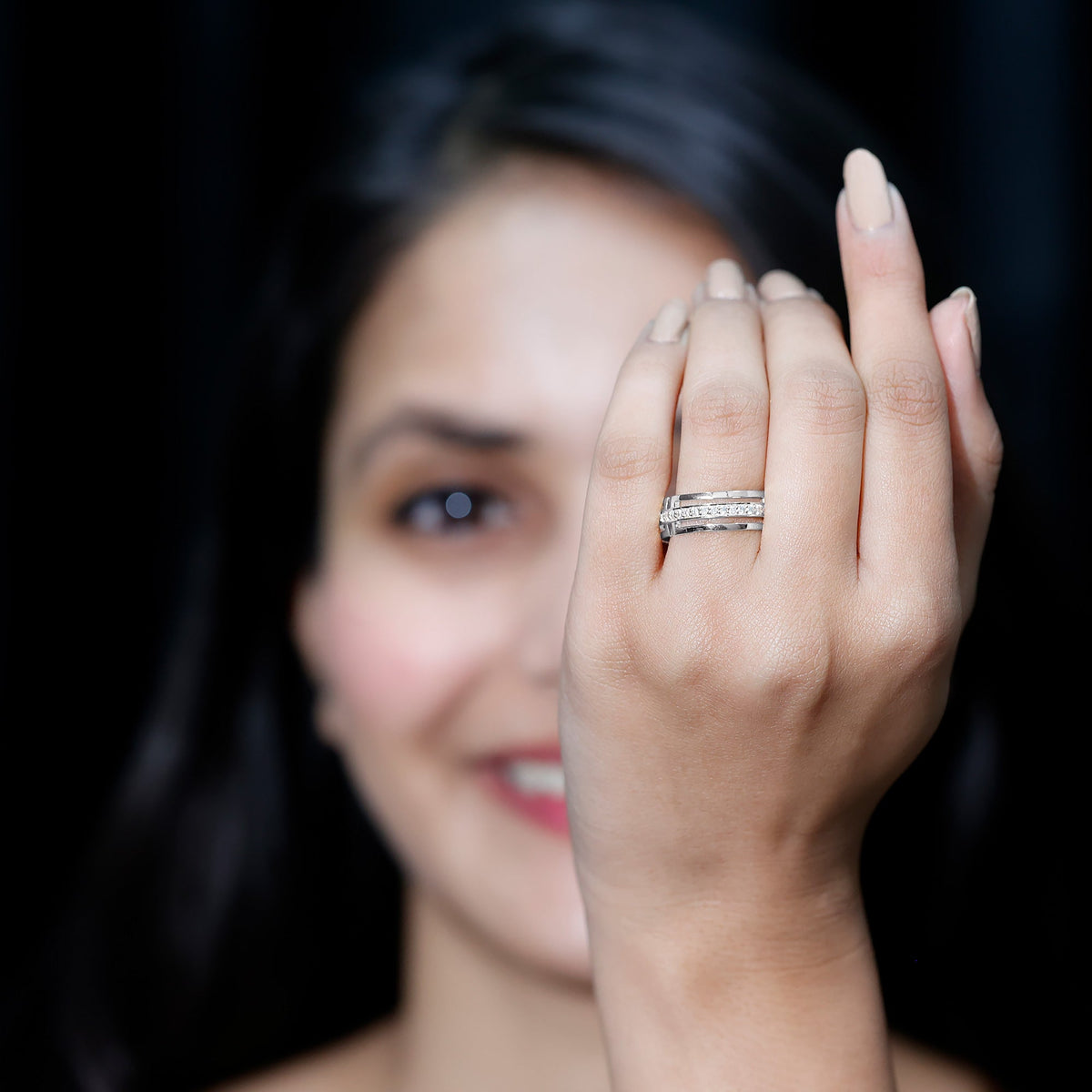 Moissanite wedding band in pinpoint setting by Rosec Jewels, close-up of sparkling ring with detailed metal band.