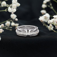Rosec Jewels Moissanite wedding band in pinpoint setting, close-up of elegant ring with sparkling stones on a white background.