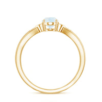 Oval cut moonstone solitaire ring with diamond accent, featuring a Rosec Jewels ring setting and elegant design.