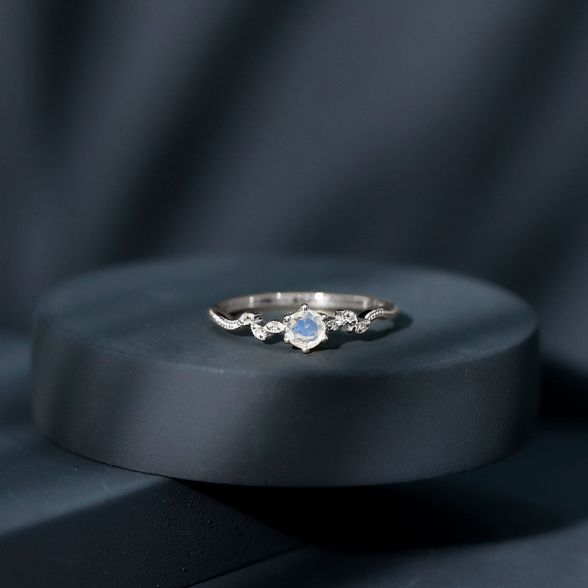 Nature-inspired moonstone and diamond promise ring for women by Rosec Jewels, featuring intricate design and sparkling gemstones.
