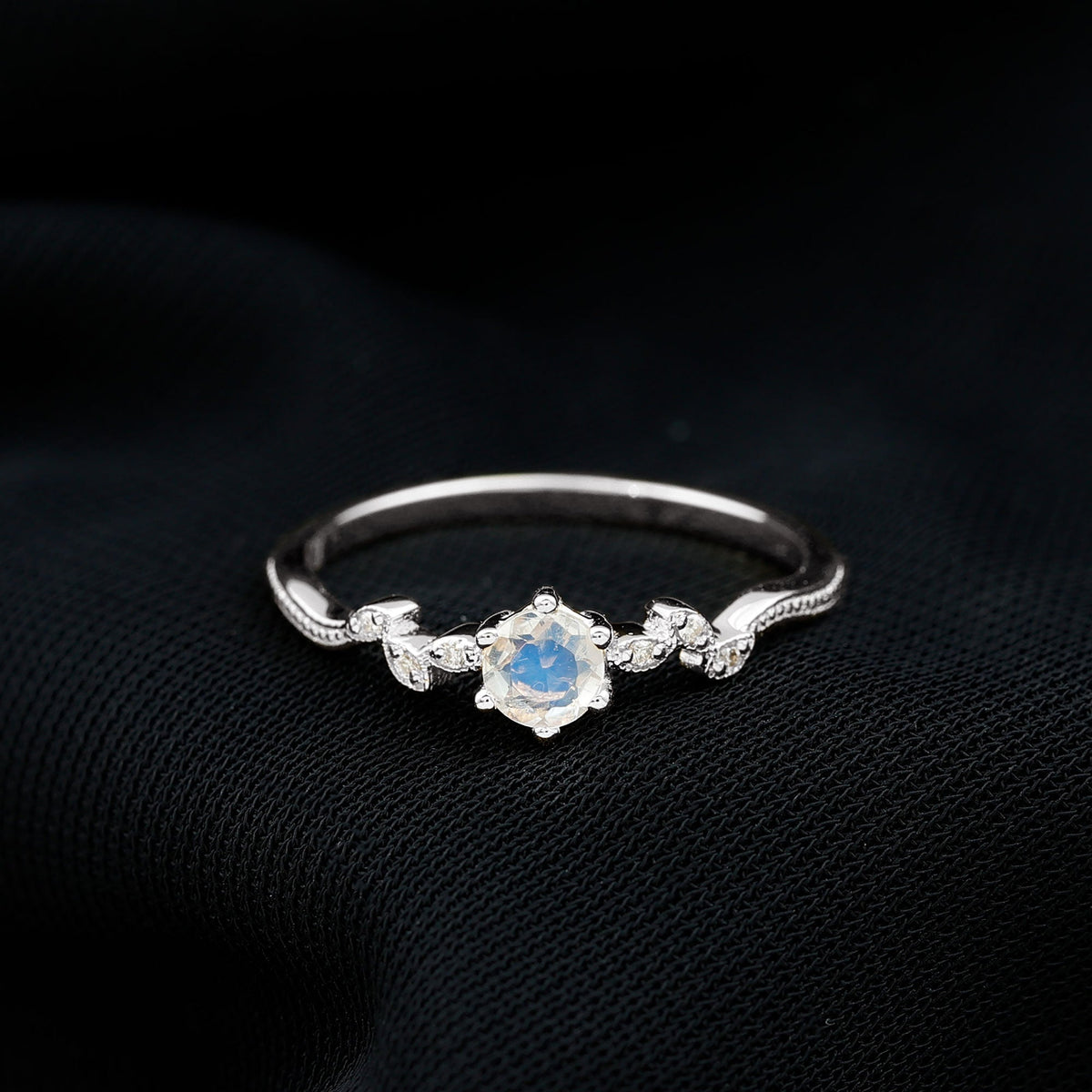 Nature-inspired moonstone and diamond promise ring for women by Rosec Jewels, featuring a delicate band and shimmering gemstones.