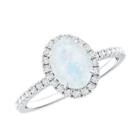 Oval moonstone engagement ring with diamond halo, set in a Rosec Jewels ring showcasing a elegant gemstone centerpiece.