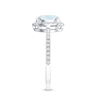 Oval moonstone engagement ring with diamond halo, featuring a Rosec Jewels design, showcasing the elegant center stone and sparkling accents.