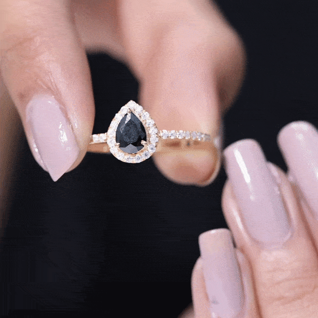Genuine black onyx teardrop engagement ring with diamond accents, crafted by Rosec Jewels, showcasing elegant jewelry design.