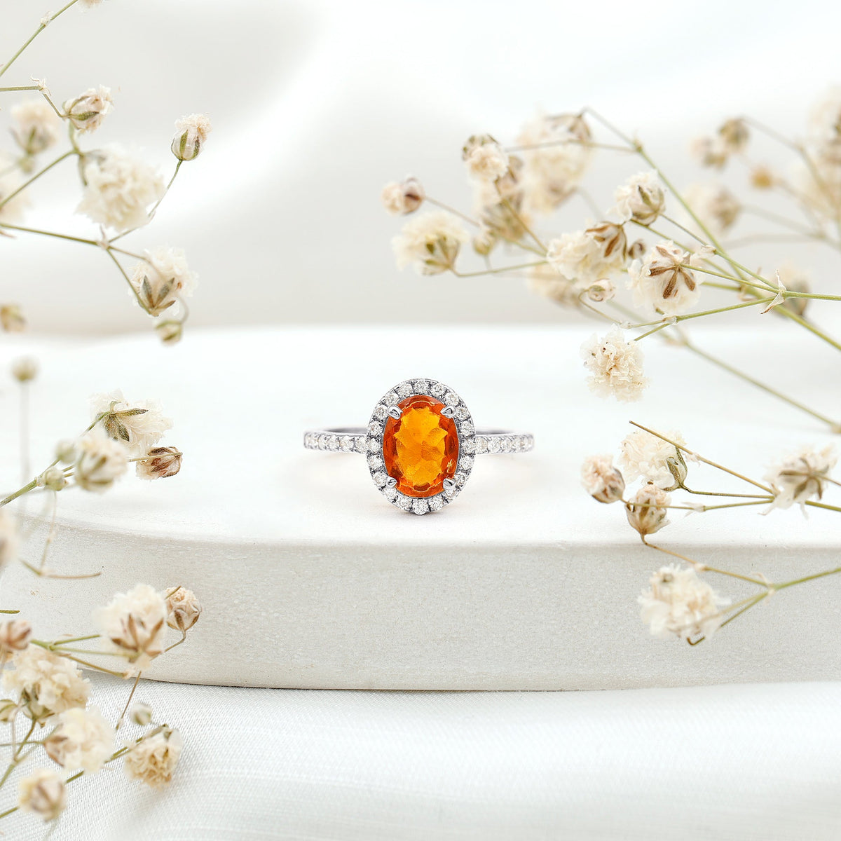 Oval 1 Carat Fire Opal engagement ring with diamond halo by Rosec Jewels, showcasing the elegant oval fire opal and sparkling diamond accents.
