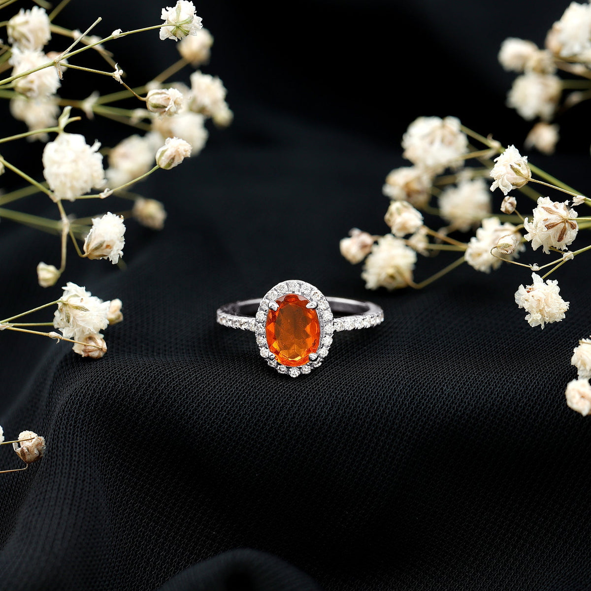 Oval 1 Carat fire opal engagement ring with diamond halo from Rosec Jewels, showcasing the sparkling gemstone and intricate design.