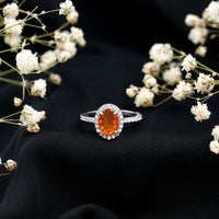 Oval 1 Carat fire opal engagement ring with diamond halo from Rosec Jewels, showcasing the sparkling gemstone and intricate design.