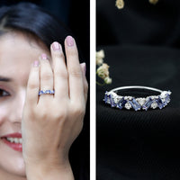 Baguette cut Tanzanite and diamond half eternity stackable ring by Rosec Jewels, featuring alternating gemstones and sleek band design.
