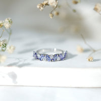 Baguette cut Tanzanite and diamond half eternity stackable ring by Rosec Jewels, showcasing alternating gemstones and elegant design.