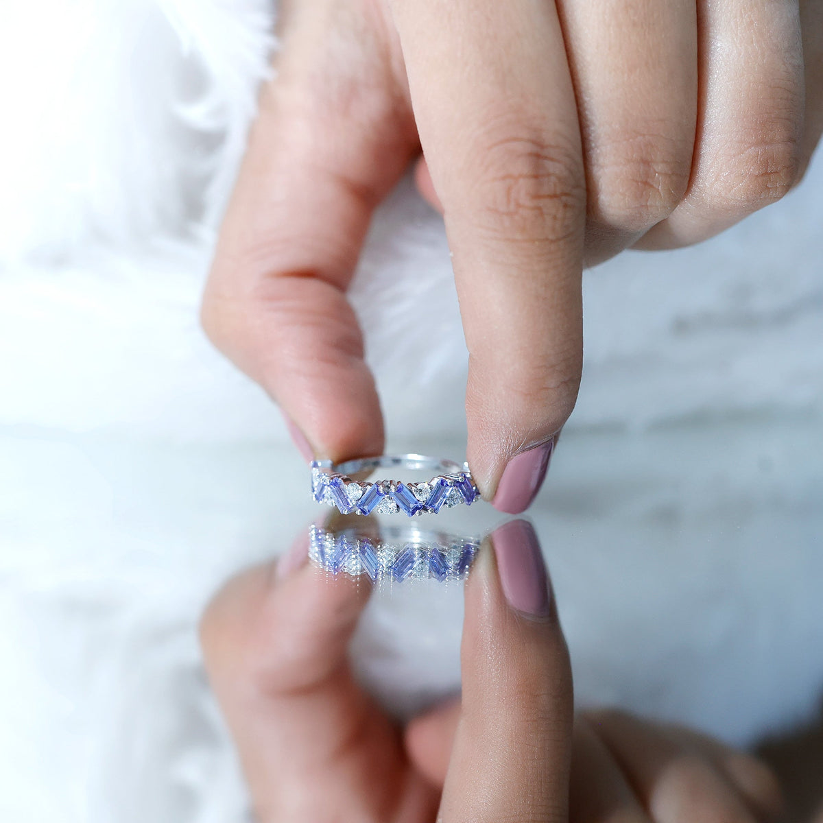 Baguette cut Tanzanite and diamond half eternity stackable ring by Rosec Jewels, showcasing alternating gemstones and sparkling band.