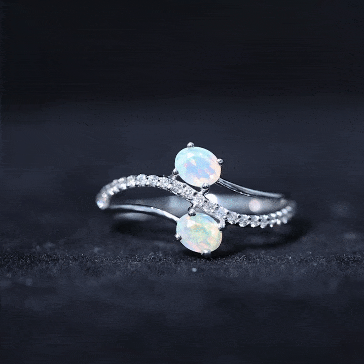 Ethiopian Opal and diamond Toi Et Moi engagement ring with bypass shank by Rosec Jewels, featuring oval gemstones and elegant design.