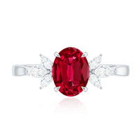 Oval lab-created ruby engagement ring with diamond accents from Rosec Jewels, showcasing a 1.5 carat ruby and sparkling diamonds.