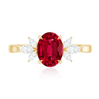 Oval lab-created ruby engagement ring with diamond accents, featuring a 1.5 carat ruby centerpiece and rose gold band.