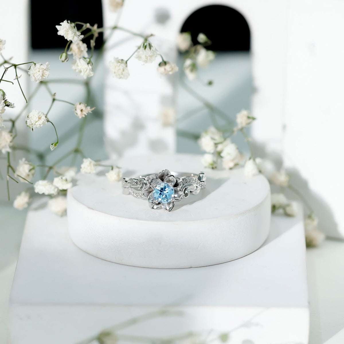 Natural aquamarine flower-inspired engagement ring with diamonds from Rosec Jewels, showcasing intricate floral design and sparkling gemstones.