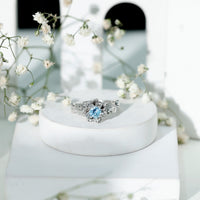 Natural aquamarine flower-inspired engagement ring with diamonds from Rosec Jewels, showcasing intricate floral design and sparkling gemstones.
