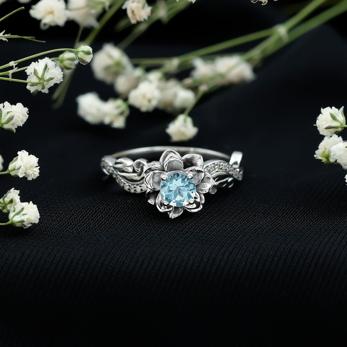 Natural aquamarine flower-inspired engagement ring with diamond accents, crafted by Rosec Jewels.