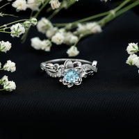 Natural aquamarine flower-inspired engagement ring with diamond accents, crafted by Rosec Jewels.
