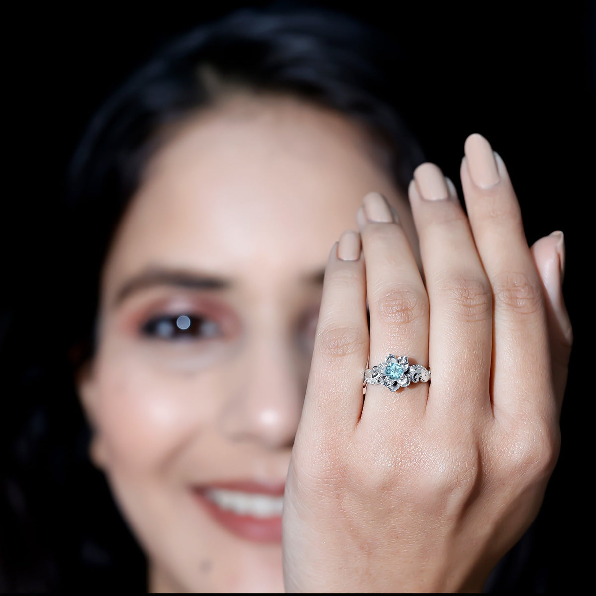 Natural aquamarine flower-inspired engagement ring with diamond accents by Rosec Jewels, showcasing detailed floral design and sparkling stones.