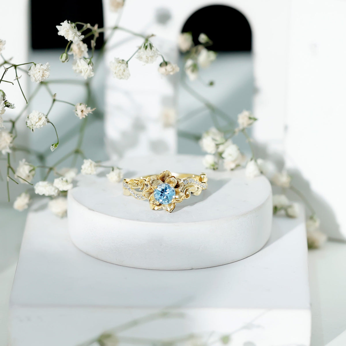 Rosec Jewels natural aquamarine engagement ring with flower-inspired design and diamond accents, showcasing intricate craftsmanship.