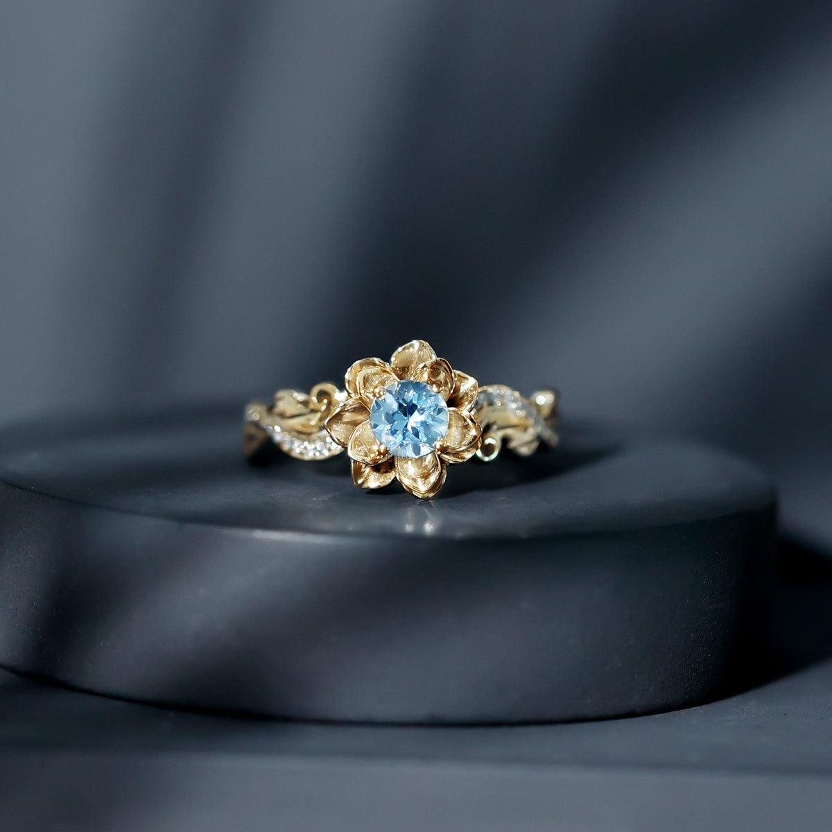 Natural aquamarine flower-inspired engagement ring with diamond accents from Rosec Jewels, showcasing intricate floral design and sparkling gemstones.