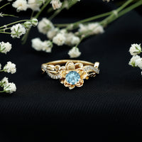 Rosec Jewels natural aquamarine flower-inspired engagement ring with diamond accents, showcasing intricate design and gemstone details.