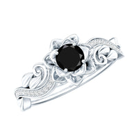 Black spinel blooming flower engagement ring with diamond accents from Rosec Jewels, showcasing intricate floral design and sparkling gemstones.