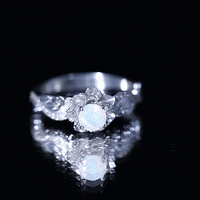 Genuine Ethiopian Opal flower engagement ring with real diamond from Rosec Jewels, showcasing a sparkling gemstone and intricate design.