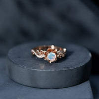 Genuine Ethiopian opal flower engagement ring with real diamond, featuring a delicate floral design and sparkling gemstone accents.