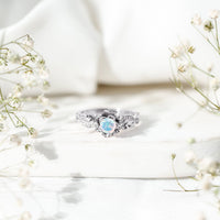 Genuine Ethiopian opal flower engagement ring with real diamond set in a silver band by Rosec Jewels.